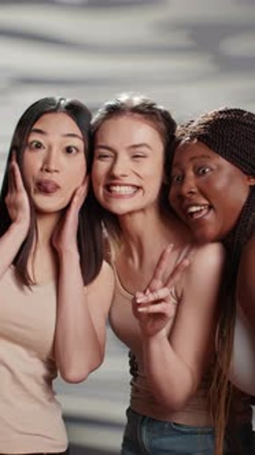 Vertical Video Group of Interracial Women Having Fun with Photos