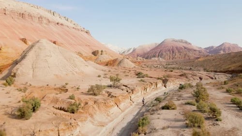 Aerial Shot of Road Near Desert Mountain
