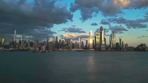 Sunset in NYC New York City Skyline with Dramatic Sky Skyscrapers in NYC Near Dramatic Clouds New