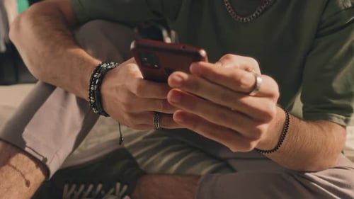 Young Adult Using Smartphone Indoors