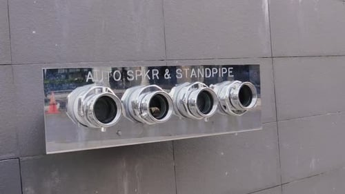 Pipe vent behind a building