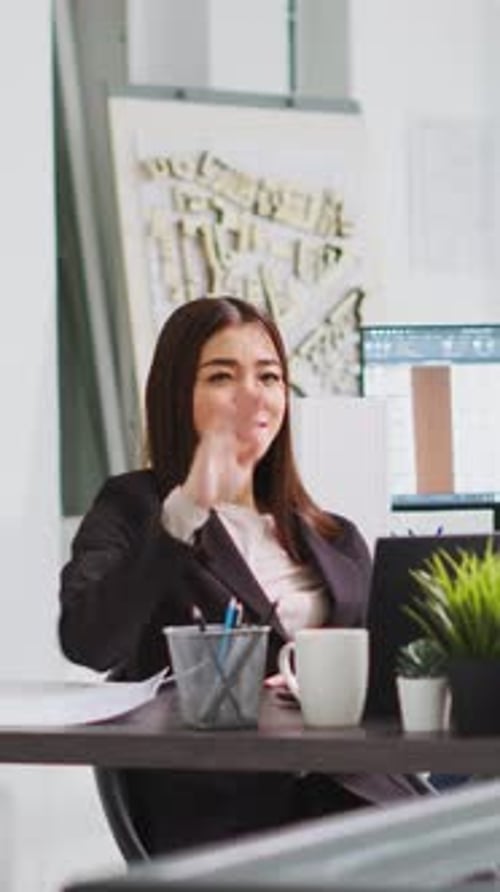 Businesswoman Discussing Architecture Plans During Online Meeting