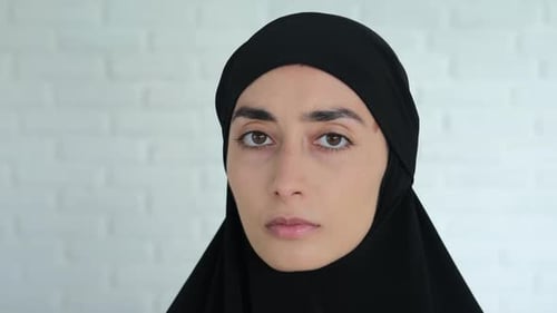 Woman with Light Brown Hair Wearing Head Covering