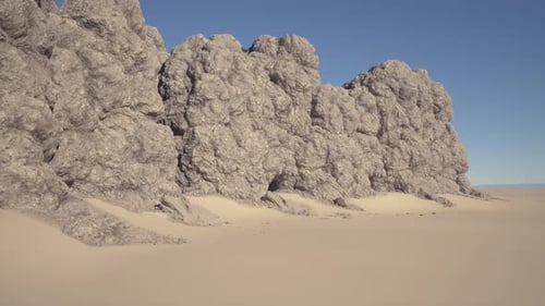 Clear Blue Sky Over Warm Beige Rocky Cliffs and Windshaped Sandy Dunes