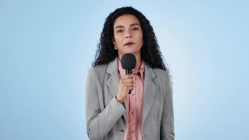 Woman, presenter and news in studio for interview, questions or speaker on blue background