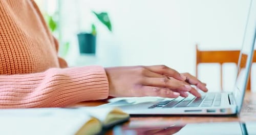 Hands typing laptop, writing notebook and online course research, planning ideas