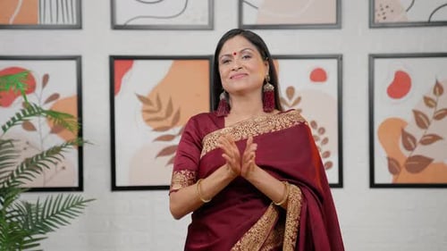 Woman in Saree Giving Traditional Greeting