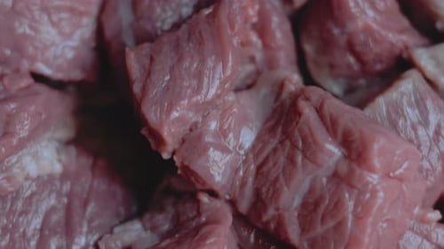 Diced Raw Beef on Cutting Board Close Up