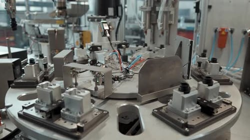 Mechanized production line with robotic arms