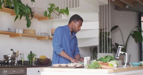 Man Preparing Food in Modern Kitchen
