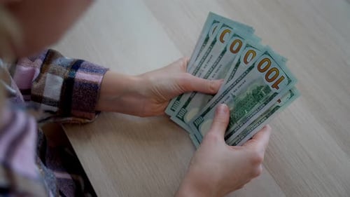 Close-up of counting money at home
