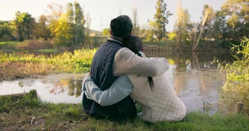 Travel, hug and couple by lake on mountain for bonding, quality time and relax in nature