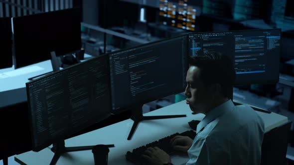 Asian Man Having Headache While Write Code With Multiple Computer ...