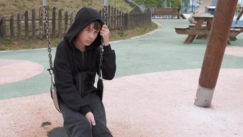 Depressed Girl Not Playing on Playground