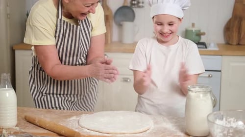 Grandmother and Grandchild Baking Together in Kitchen