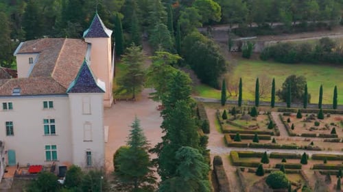 Aerial view of French lucurious Chateau with scenic garden in Restinclières.