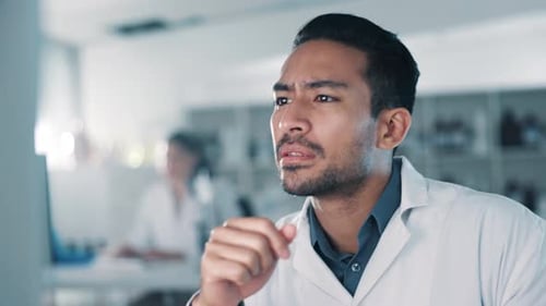 Serious Scientist Thinking in Bright Laboratory