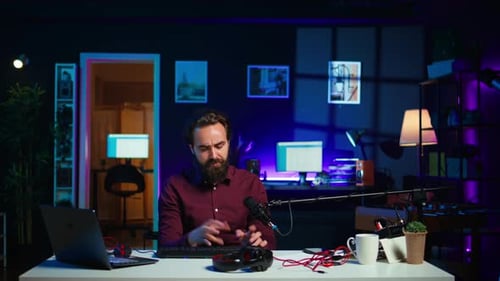Bearded Man Demonstrates Computer and Gaming Equipment