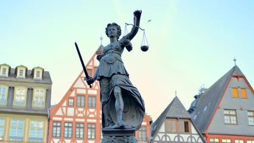 Justice fountain square statue and buildings in Frankfurt, Germany