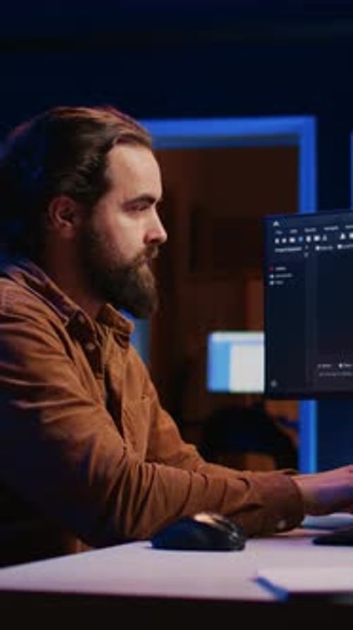 Computer Engineer Deliberating Ways of Fixing Errors While Developing Code