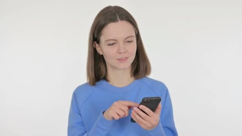 Woman Using Smartphone Indoors on White Background