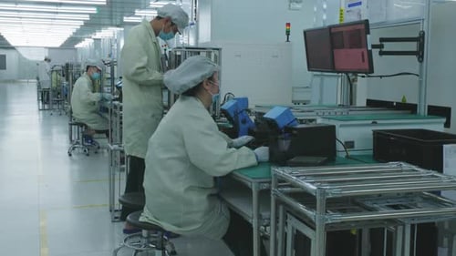 Chinese People Working In Factory