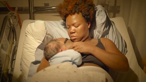 A Mother Embraces Her Newborn Baby in a Hospital Bed Showing Love Bonding and New Life Starting