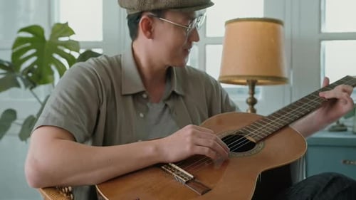 A musician is writing song in home Studio