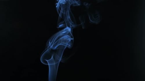 Abstract smoke rising on black background