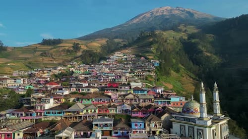 Colourful houses and mosque of Nepal Van Java Indonesian village in Java. Aerial