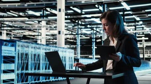 Data Center Female Admin Uses Device and AR Simulation to Conduct Security Audit