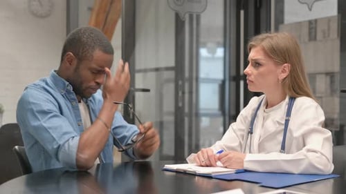 Patient Talking With Doctor During Medical Consultation