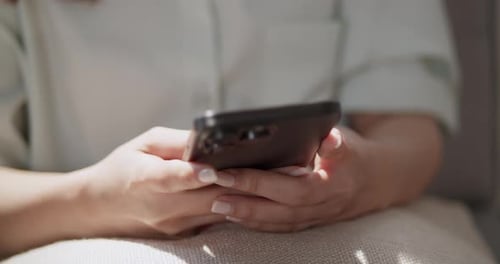 Engaging with mobile technology a cozy indoor setting lifestyle focus personal connection