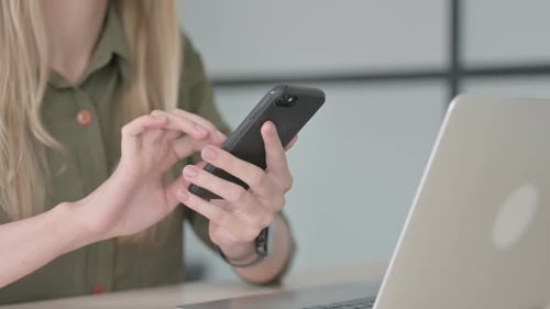 Close Up of Blonde Woman Using Smartphone