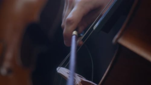 Hand of Musician Playing Cello with Bow