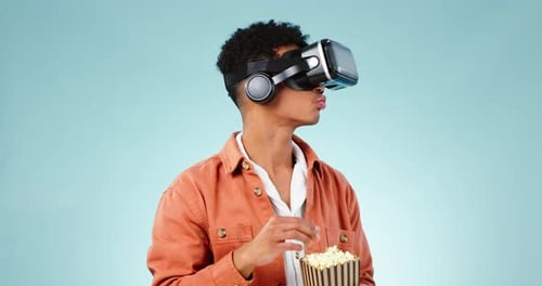 Popcorn, VR or man in studio for a movie with snack for watching tv or film on blue background