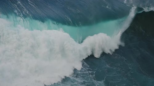 Large ocean wave crashing in super slow motion. Force, power and energy of nature.