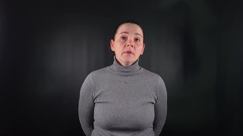 Woman Talking and Giving a Thumbs Up