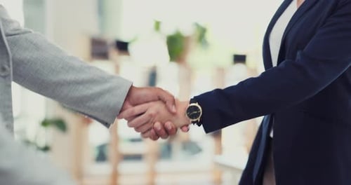 Handshake, bribery and corruption with business people in an office exchanging the payment of cash