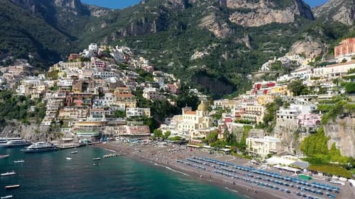 Aerial view of Positano with comfortable beach and blue sea on Amalfi Coast in Campania, Italy. Posi