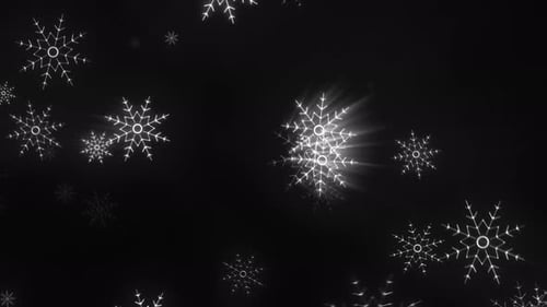 Des flocons de neige blancs brillants illuminés sur un fond noir foncé, capturant une atmosphère sereine et glaciale
