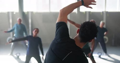 Adults Exercise Class Stretching with Gym Instructor