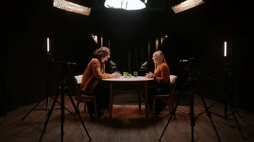 Engaging Conversation Unfolds in a Cozy Podcast Studio With Expert Voices and Storytelling Magic