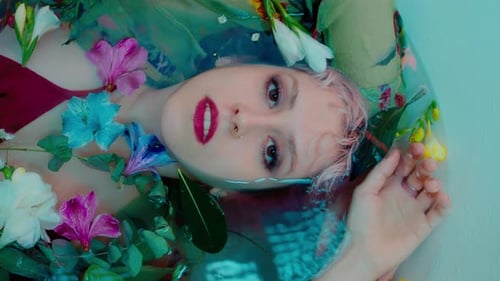 Woman in Bath with Colorful Flowers