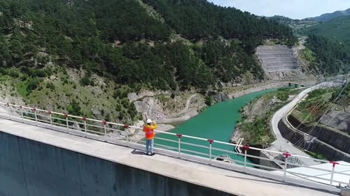 Man Walking On Dam 12