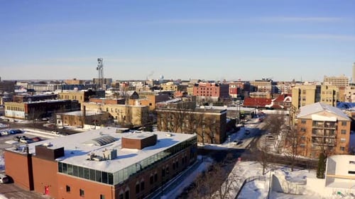 Winter Aerial of Snow-Covered City on Sunny Day