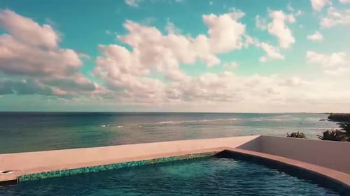 View of the ocean from a rooftop with pool on a vacation rental property. Quintana Roo, Mexico