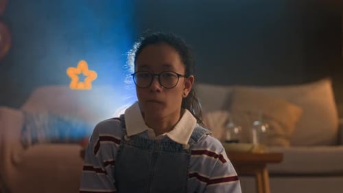Asian Preteen Girl Eating Popcorn and Watching Movie