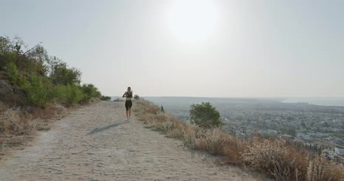 Sporty Girl Jogging Near the Ocean