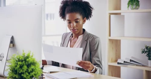 4k video footage of a young attractive businesswoman working in her office